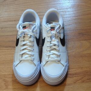 Nike White Sneakers with Black Swoosh